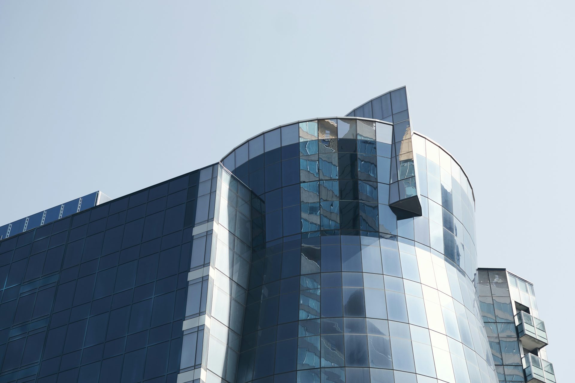blue glass walled high rise building
